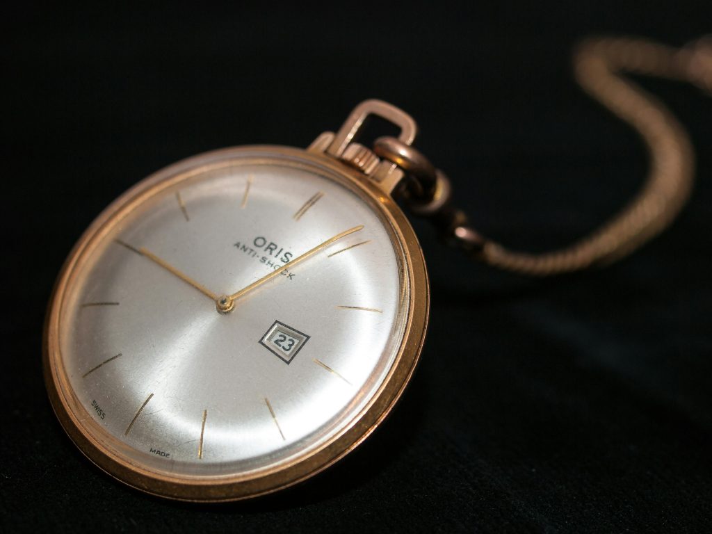 Close-up shot of an elegant Oris wristwatch, showcasing detail and style.